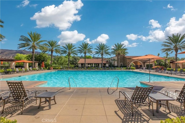 community pool featuring a patio