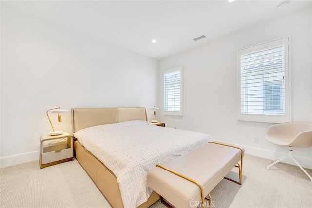 bedroom with recessed lighting, baseboards, visible vents, and light carpet