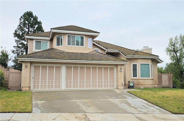 view of front of property with stucco siding, driveway, a front yard, and a tiled roof