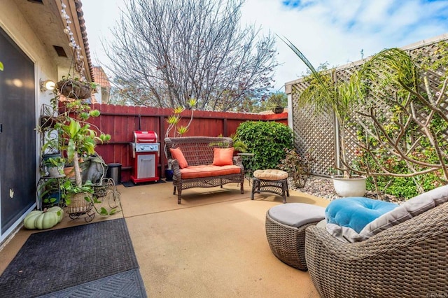 view of patio / terrace featuring area for grilling and fence