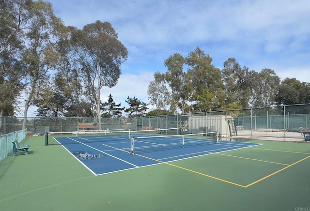 view of sport court with fence