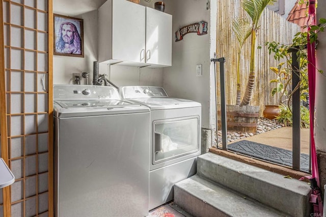 laundry area with cabinet space and washing machine and dryer