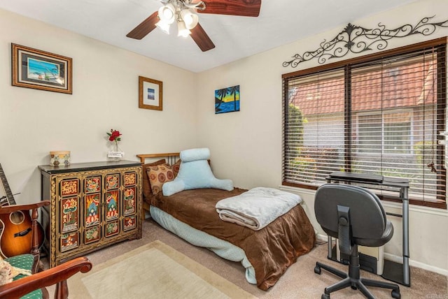 bedroom featuring baseboards, carpet, and a ceiling fan