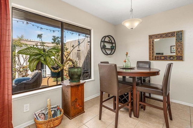 tiled dining space with baseboards