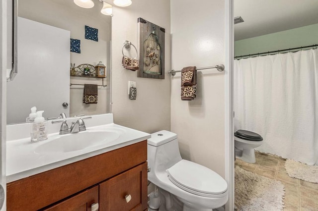 full bathroom featuring vanity, a shower with curtain, visible vents, tile patterned flooring, and toilet