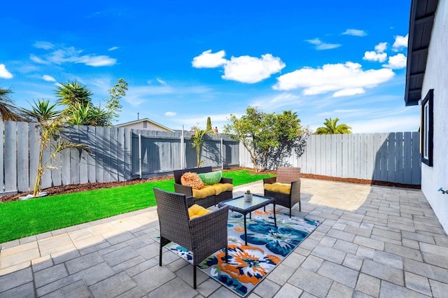 view of patio / terrace featuring an outdoor living space and a fenced backyard