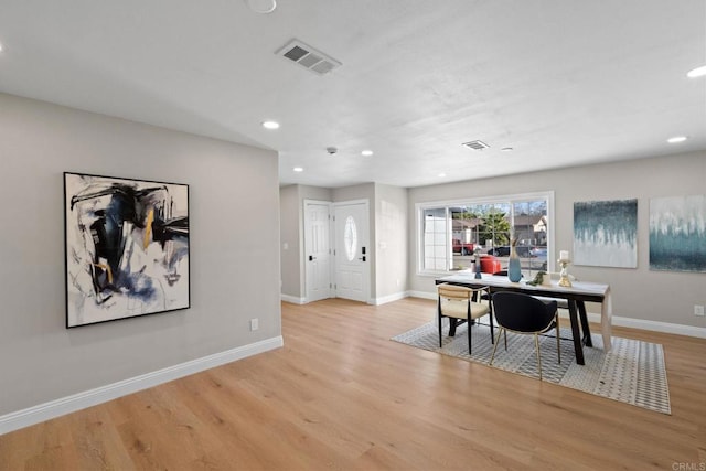 dining room with recessed lighting, baseboards, visible vents, and light wood finished floors