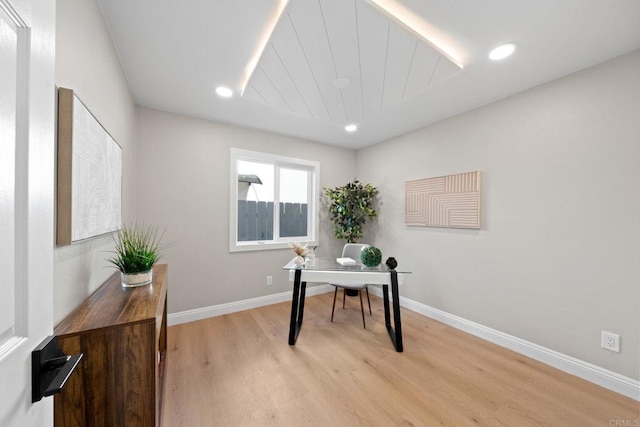 office space featuring recessed lighting, baseboards, and light wood-type flooring