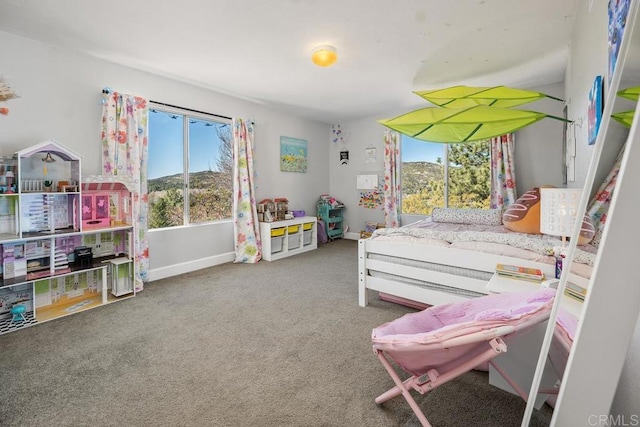 carpeted bedroom with baseboards