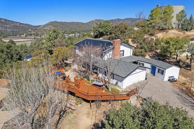 birds eye view of property featuring a mountain view