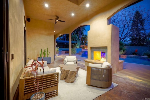 view of patio / terrace featuring an outdoor living space, a fenced in pool, ceiling fan, and fence