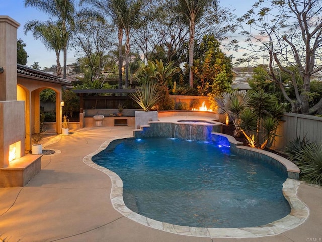 view of pool with a fenced in pool, a fenced backyard, a hot tub, and a patio area