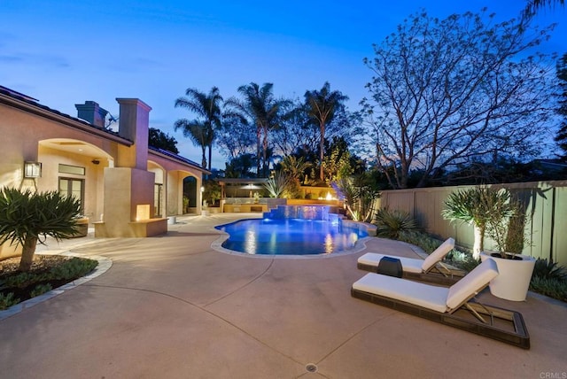view of swimming pool with a patio, a fenced in pool, and a fenced backyard