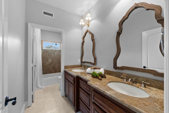 full bathroom with a sink, toilet, double vanity, and visible vents