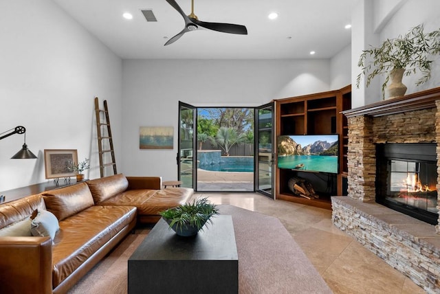 living area featuring a ceiling fan, visible vents, tile patterned flooring, a fireplace, and recessed lighting