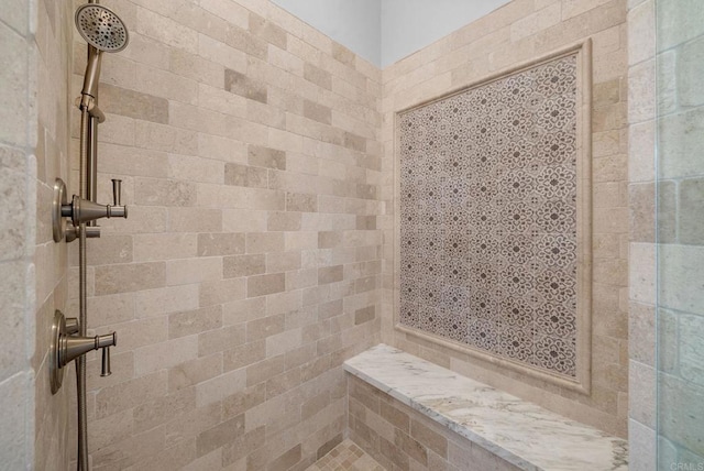 bathroom featuring a tile shower