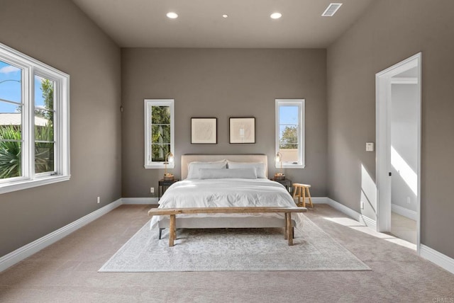 bedroom with light colored carpet, baseboards, visible vents, and recessed lighting