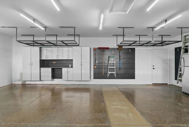 garage with freestanding refrigerator