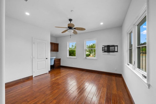 empty room featuring baseboards, recessed lighting, ceiling fan, and dark wood-style floors