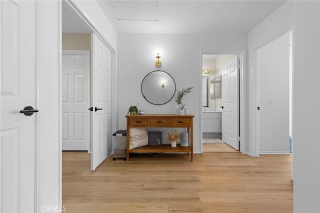 hallway featuring light wood finished floors