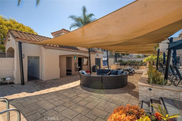 view of patio / terrace featuring an outdoor living space and fence