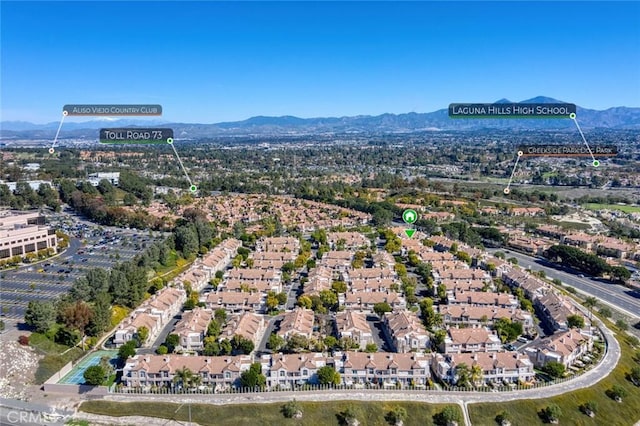 birds eye view of property featuring a mountain view and a residential view