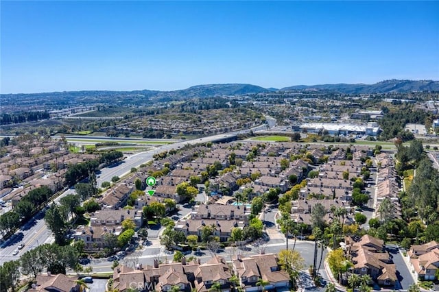 birds eye view of property with a mountain view and a residential view