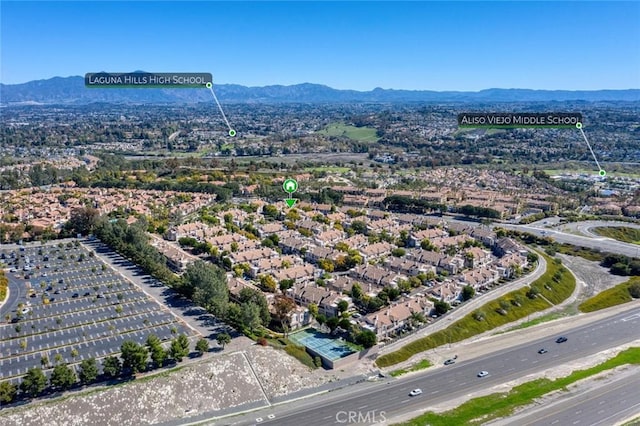 birds eye view of property with a mountain view