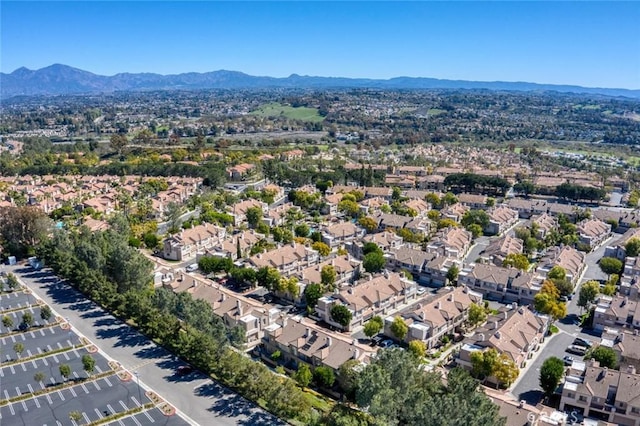 birds eye view of property with a residential view and a mountain view