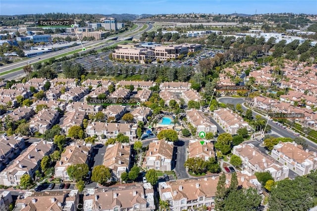 birds eye view of property with a residential view