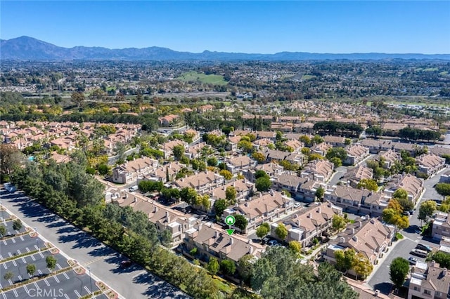 birds eye view of property with a residential view and a mountain view