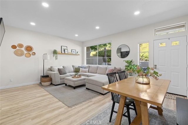 living area with recessed lighting, baseboards, and wood finished floors