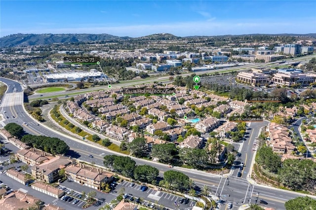 birds eye view of property with a mountain view