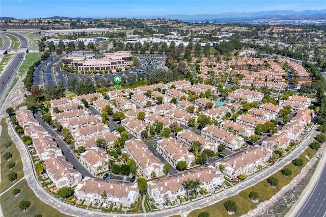 birds eye view of property featuring a mountain view and a residential view