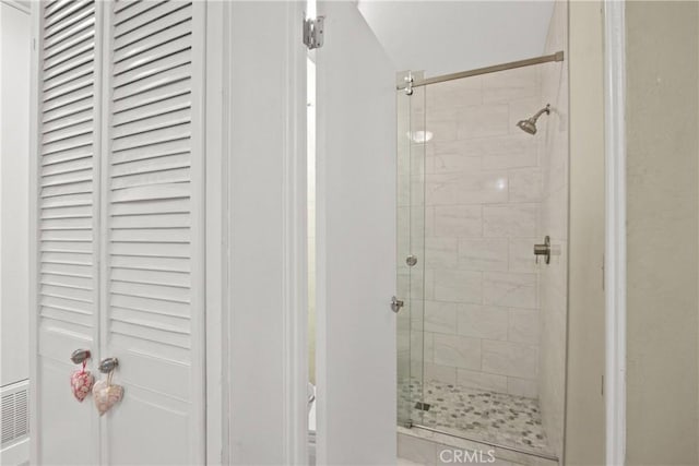 bathroom featuring a shower stall