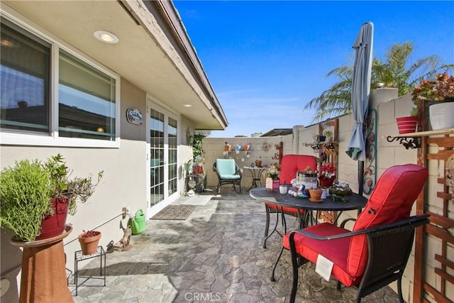 view of patio featuring fence