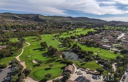 bird's eye view featuring golf course view and a mountain view