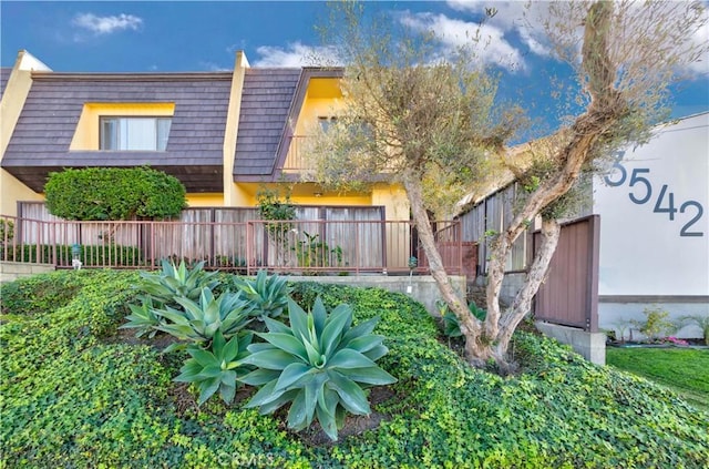 3452 W 170th St, Torrance, CA 90504 - view of property featuring mansard roof and fence