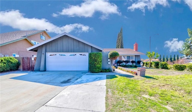 ranch-style home featuring concrete driveway, fence, a garage, and a front yard