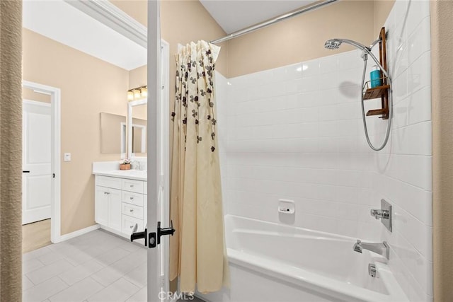 full bathroom featuring baseboards, shower / bath combo with shower curtain, and vanity