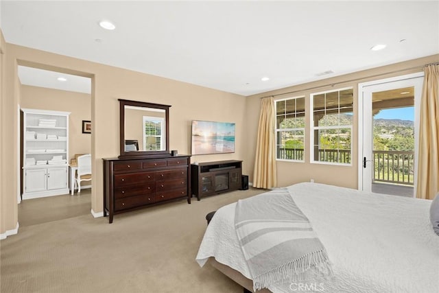 bedroom featuring recessed lighting, baseboards, light carpet, and access to exterior