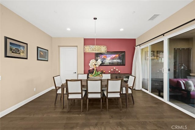 dining area with dark wood finished floors, visible vents, recessed lighting, and baseboards