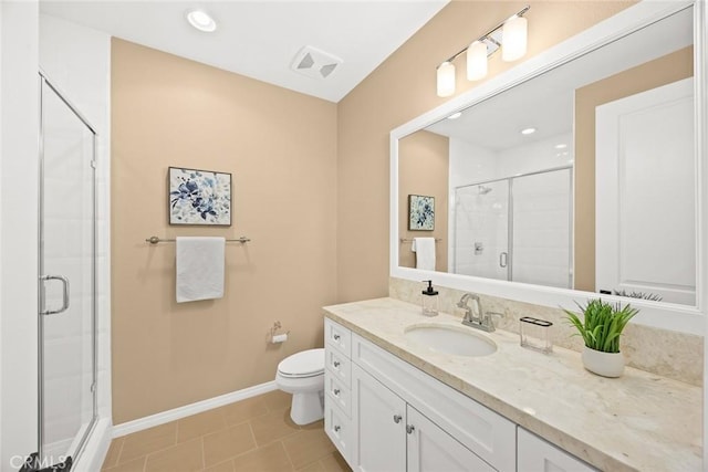 full bath featuring vanity, baseboards, a stall shower, tile patterned flooring, and toilet