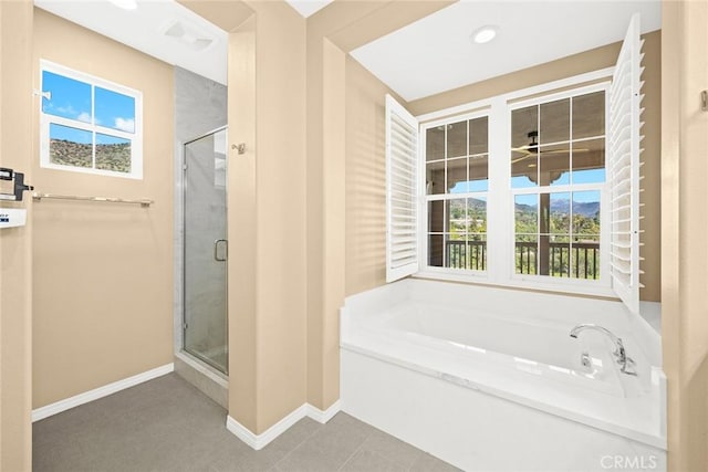 bathroom featuring recessed lighting, a stall shower, baseboards, and a garden tub