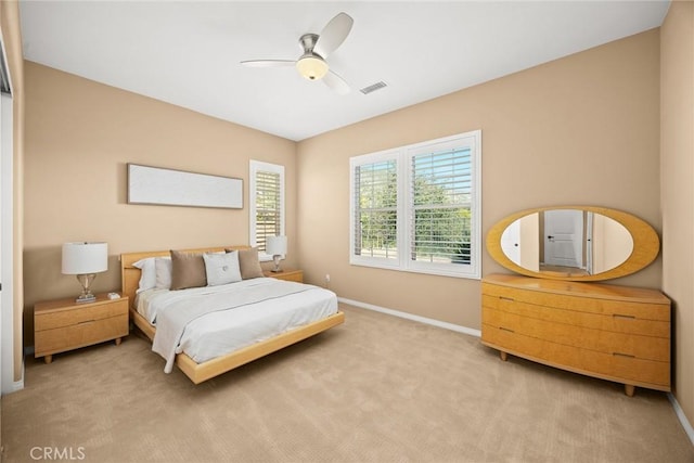 bedroom with visible vents, carpet floors, baseboards, and ceiling fan