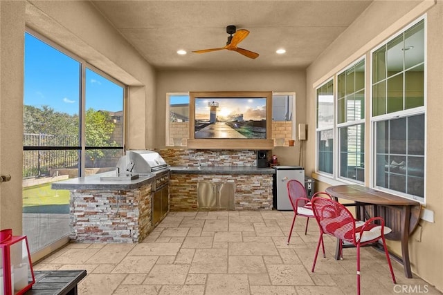 view of patio with grilling area, ceiling fan, and area for grilling