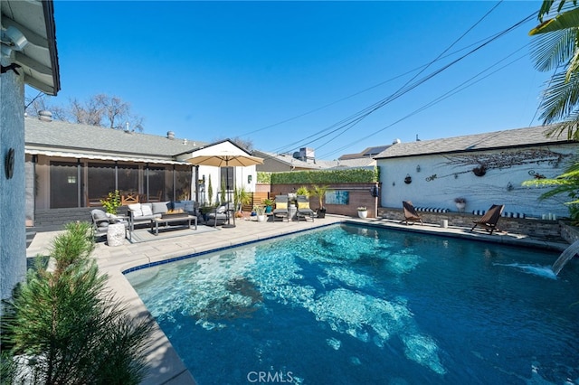 view of swimming pool with an outdoor living space, fence, a patio, and a fenced in pool