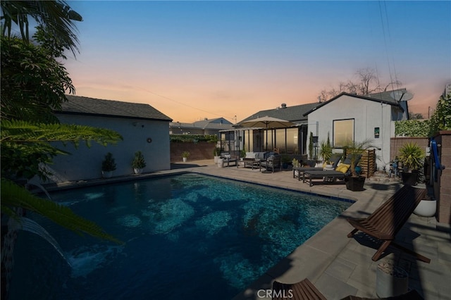 view of pool with fence, a patio area, a fenced in pool, and an outdoor hangout area