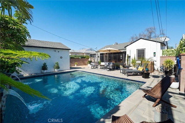 view of swimming pool featuring a patio, a fenced in pool, fence, and a sunroom