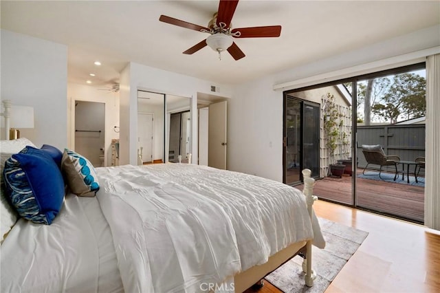 bedroom with visible vents, recessed lighting, wood finished floors, a ceiling fan, and access to outside